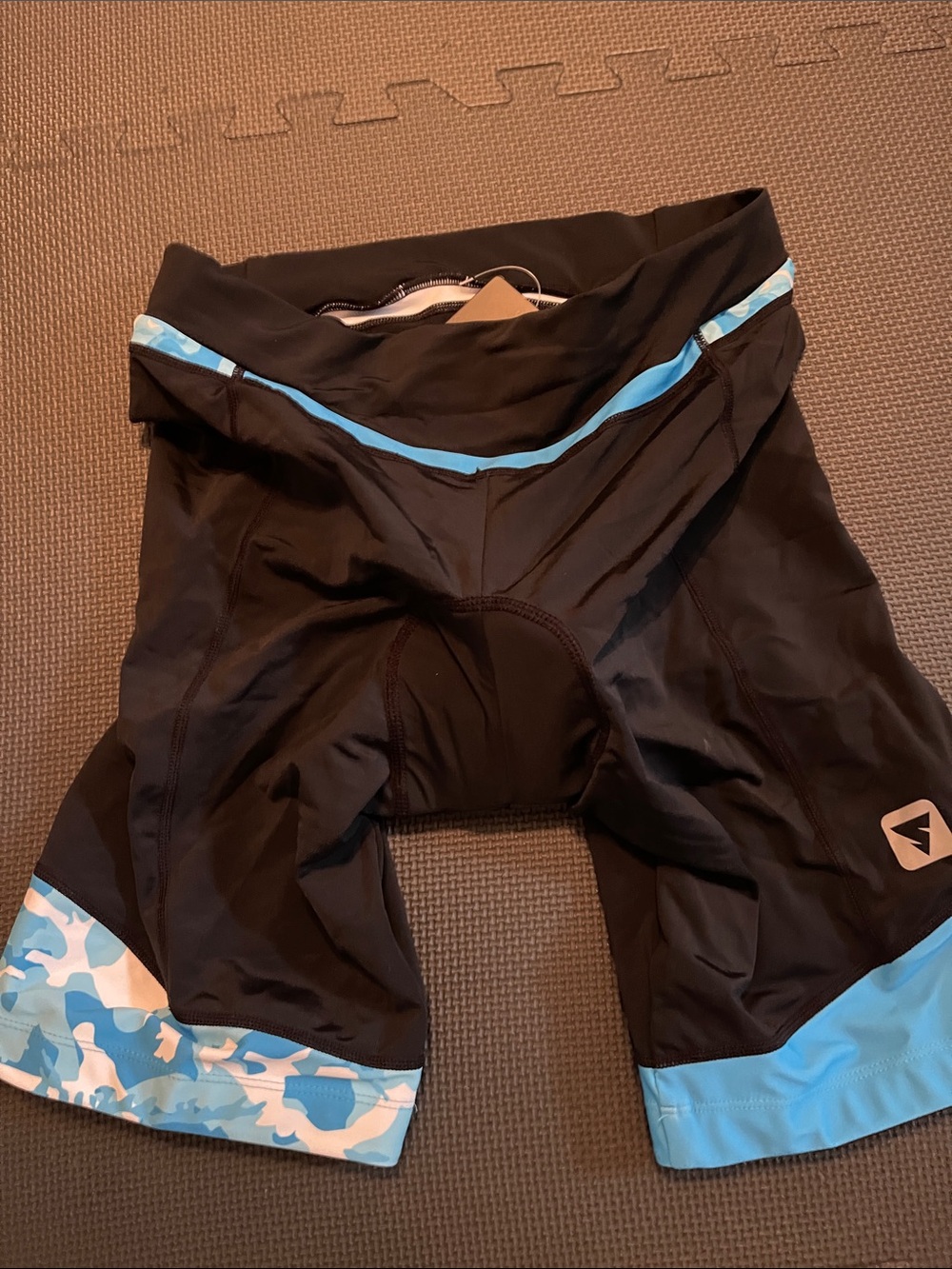 Woman Black Cycling Shorts with Light Blue Trim and Camouflage Hem